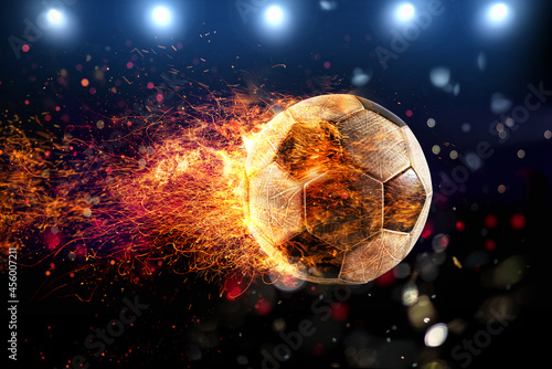 Powerful kick of a soccer ball with flame of fire