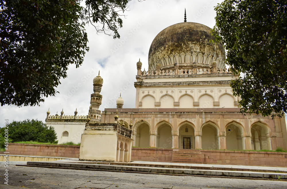 Antique Islamic Architectural Art Pointed Arches Seven Tombs Dome and Blue Sky Green Trees