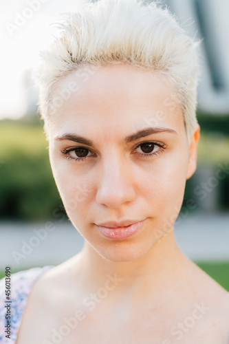 Portrai of younf confident caucasian feminist woman outdoor photo