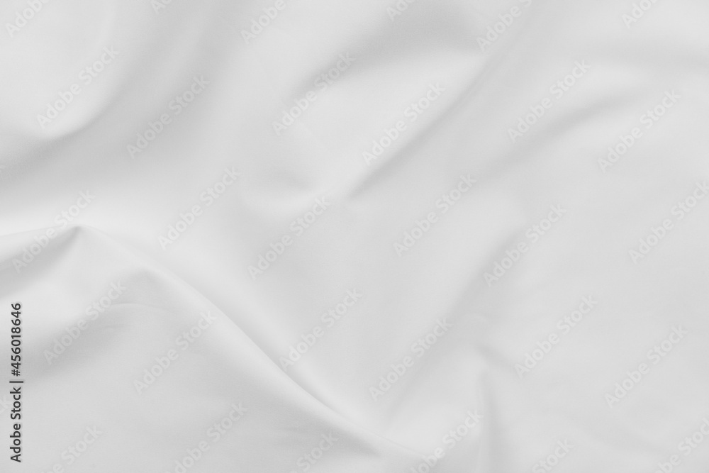 Abstract white fabric texture background. Cloth soft wave. Creases of satin, silk, and cotton.