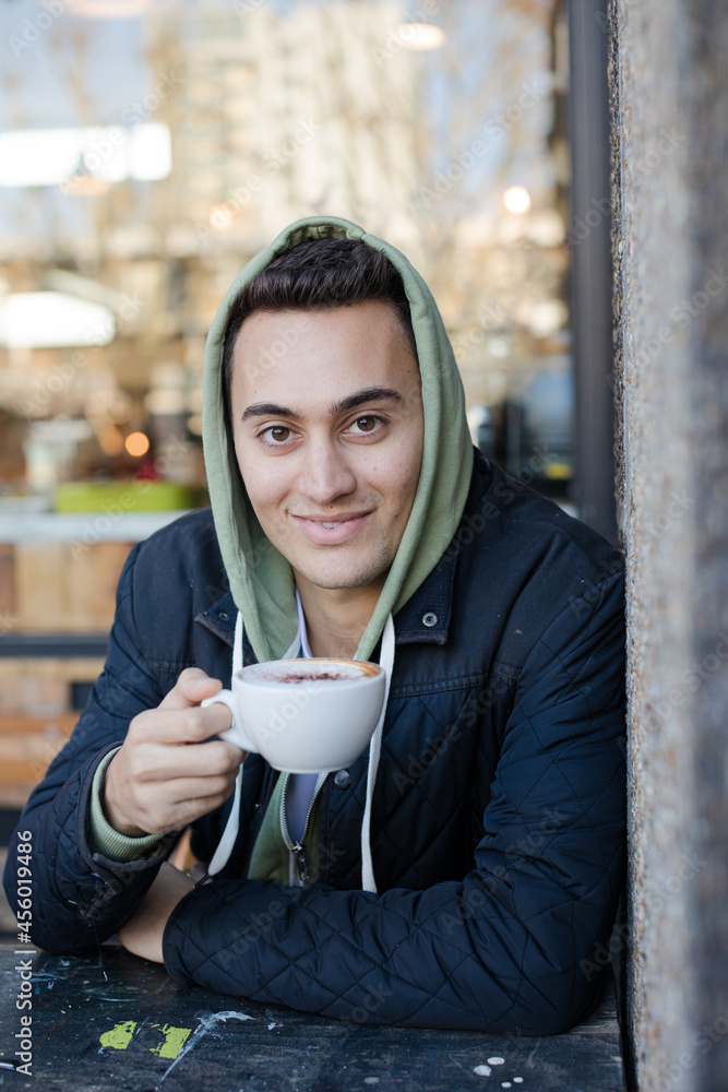 Portrait of teenage boy drinking coffee Portrait of teenage boy drinking coffee