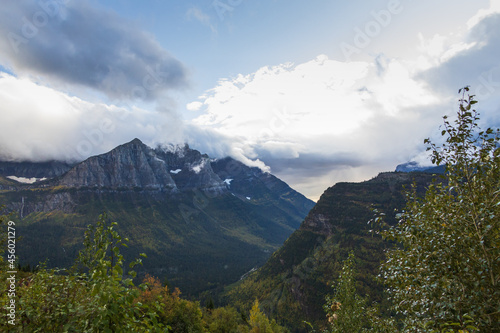 Storm clouds over mountains and valley in Glacier National Park  Montana  USA