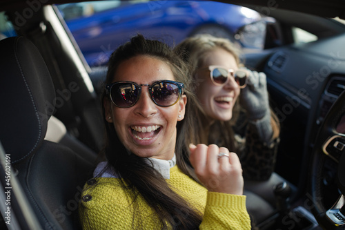Portrait happy, playful young women wearing sunglasses in car © KOTO