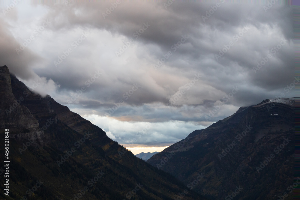 Storm clouds over mountains and valley in Glacier National Park, Montana, USA Storm clouds over mountains and valley in Glacier National Park, Montana, USA