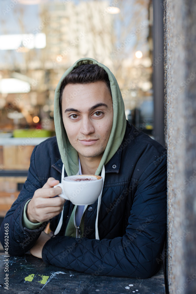 Portrait of teenage boy drinking coffee Portrait of teenage boy drinking coffee