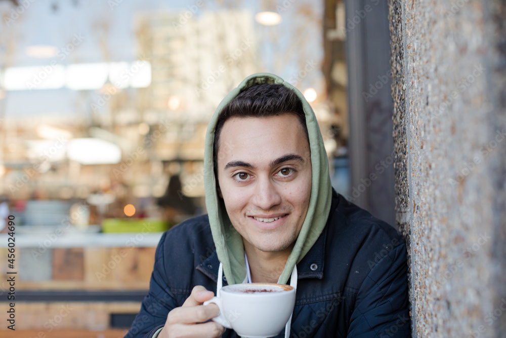 Portrait of teenage boy drinking coffee Portrait of teenage boy drinking coffee