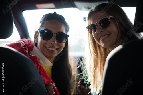 Portrait happy, playful young women wearing sunglasses in car