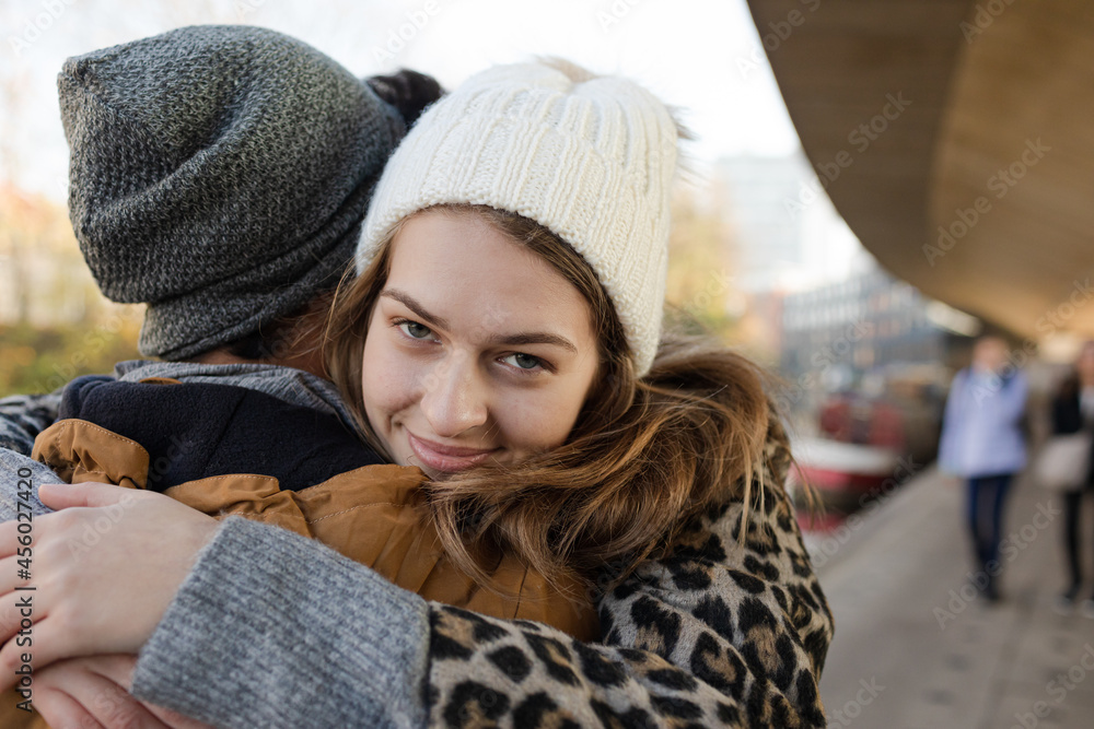 Affectionate young couple hugging outdoors Affectionate young couple hugging outdoors