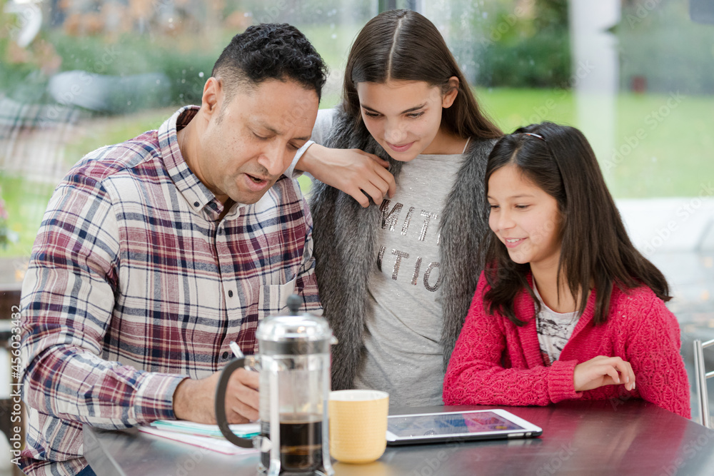 custom made wallpaper toronto digitalFather and daughters using digital tablet in morning kitchen
