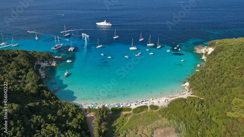 Aerial drone photo of beautiful azure exotic turquoise beach of Voutoumi in island of Antipaxos a popular yacht and sailboat anchorage with crystal clear calm sea, Ionian, Greece