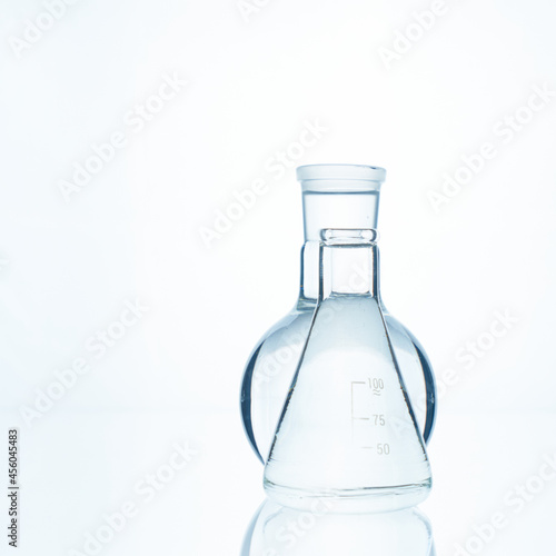 Two glass flasks. Chemical flask. Glassware.