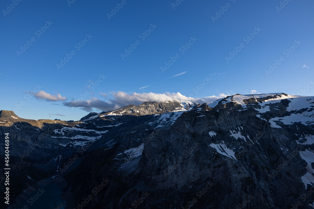 Amazing view to the peaks of the alps in Switzerland. Beautiful scenery in one of the most beautiful place in the world. Snow covered peaks and a blue sky.