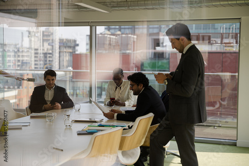 Businessman leading conference room meeting