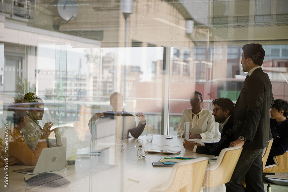 Businessman leading conference room meeting Businessman leading conference room meeting