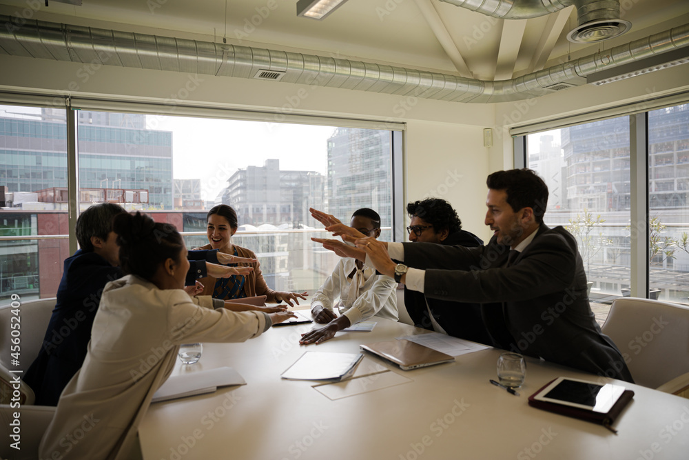 Happy business people celebrating success in office