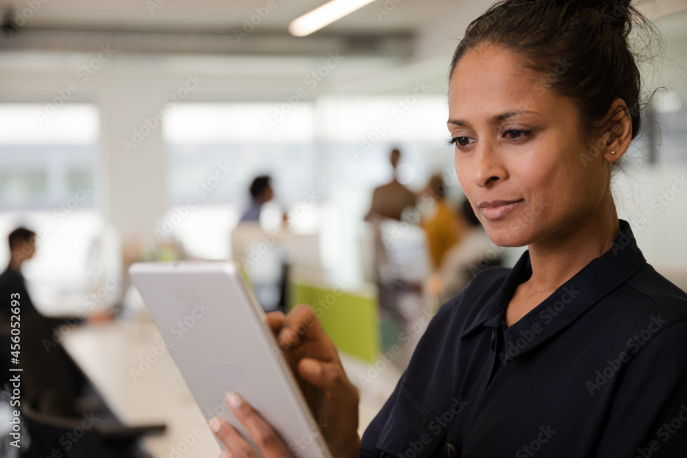 Portrait of confident businesswoman in open plan office Portrait of confident businesswoman in open plan office