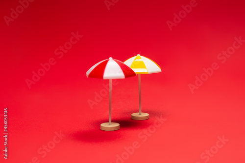 Yellow umbrella on a red background.