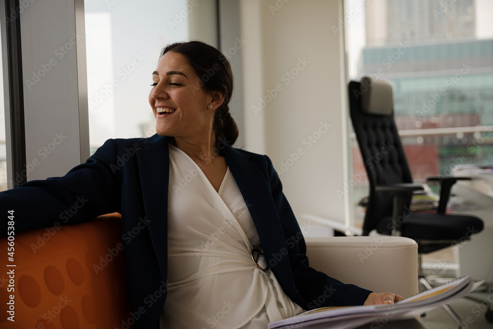 Portrait of businesswoman using smartphone in office Portrait of businesswoman using smartphone in office