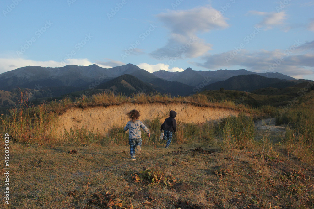 Children running in the mountains