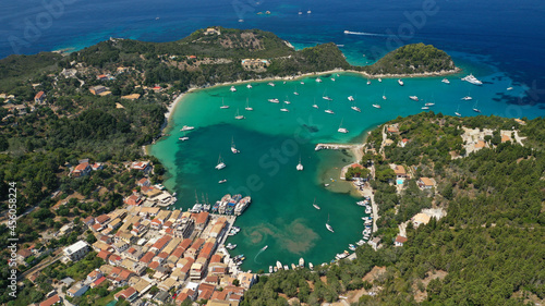 Fototapeta Naklejka Na Ścianę i Meble -  Aerial drone photo of iconic port and fishing village of Lakka or Laka with traditional Ionian architecture a safe anchorage for sail boats and yachts, Paxos island, Ionian, Greece