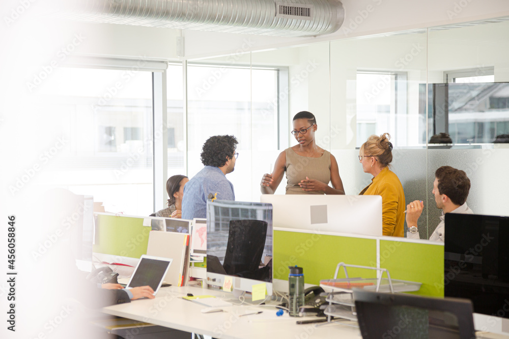 Business people meeting in open plan office Business people meeting in open plan office