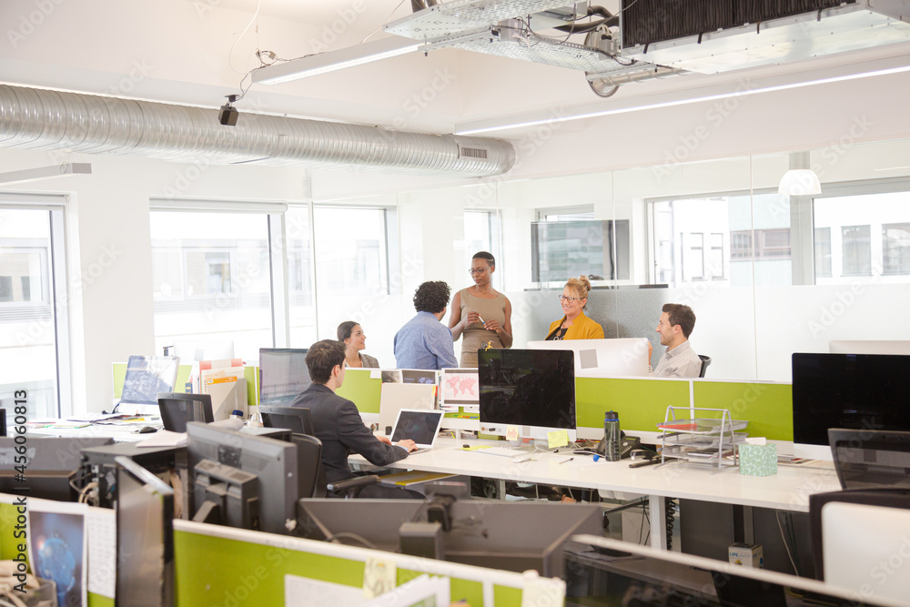Business people meeting in open plan office Business people meeting in open plan office
