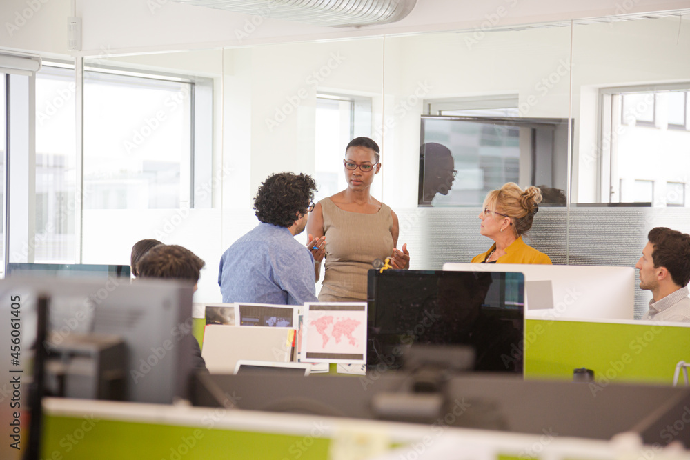 Business people meeting in open plan office Business people meeting in open plan office