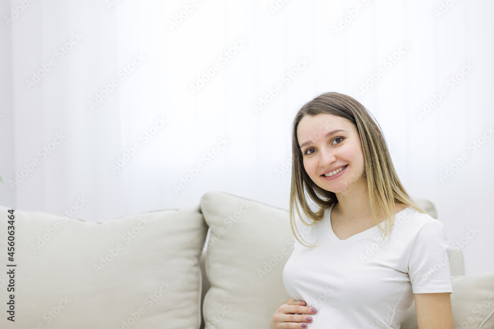Cropped view of cute pregnant woman on white background. Cropped view of cute pregnant woman on white background.