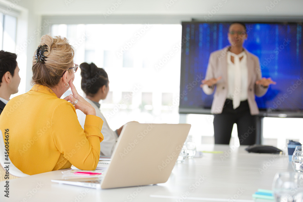 Businesswoman leading conference room meeting Businesswoman leading conference room meeting