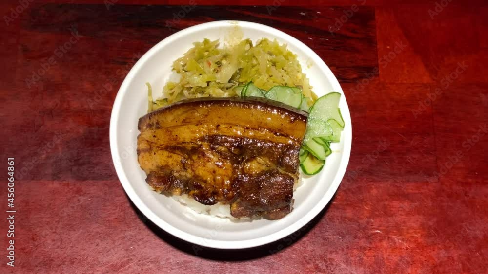 Dongpo's braised pork in brown sauce on white rice, served on table restaurant. Chinese pig belly caramelized. Delicious food cooking traditional Taiwanese. Yummy meals dishes for dinner at Taiwan-Dan Dongpo's braised pork in brown sauce on white rice, served on table restaurant. Chinese pig belly caramelized. Delicious food cooking traditional Taiwanese. Yummy meals dishes for dinner at Taiwan-Dan