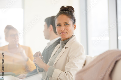 Portrait of smiling businesswoman in conference room meeting
