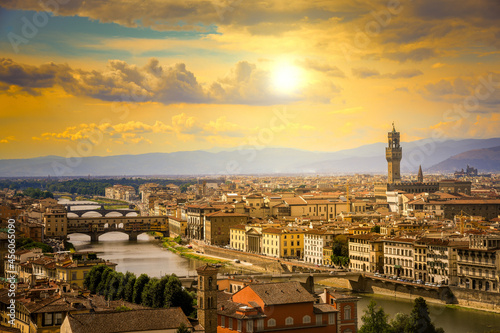 Beautiful panoramic view of Florence at the sunset with clouds. Italian panorama of a city in Tuscany at golden hour. Top aerial landscape view of an ancient historical tourist destination in Europe