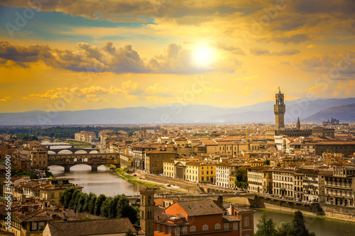 Beautiful panoramic view of Florence at the sunset with clouds.  Italian panorama of a city in Tuscany at golden hour. Top aerial landscape view of an ancient historical tourist destination in Europe