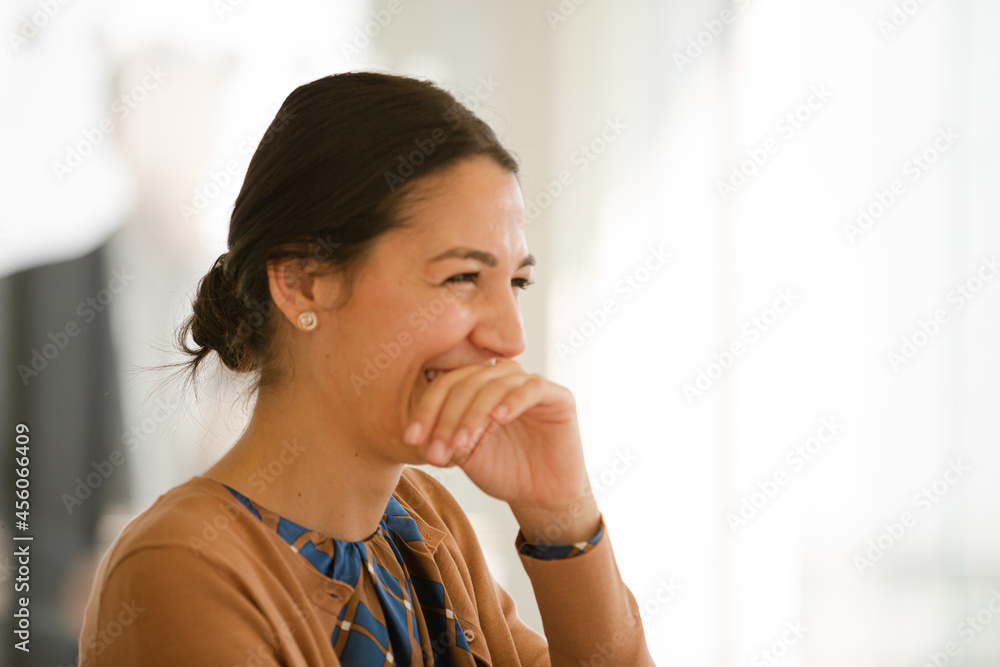 Portrait of laughing businesswoman in conference room meeting Portrait of laughing businesswoman in conference room meeting