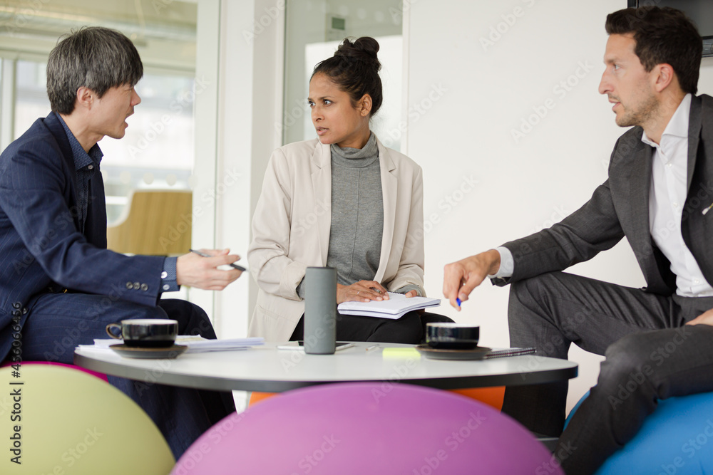 Business people brainstorming in relax zone Business people brainstorming in relax zone