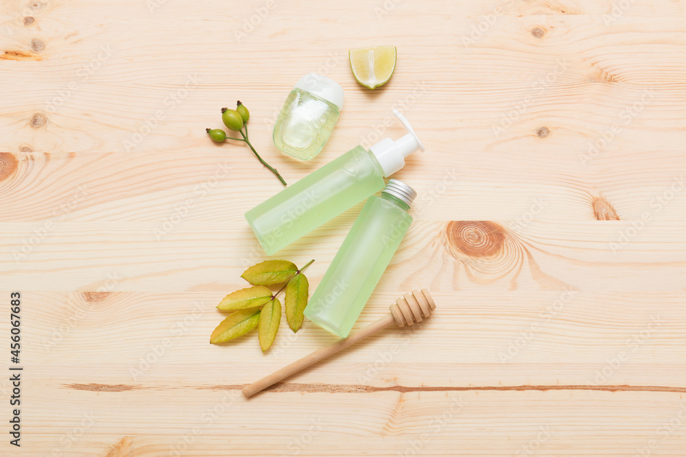 Natural cosmetic products on a light wooden. Mockup of cosmetic bottles. Natural cosmetic products on a light wooden. Mockup of cosmetic bottles.