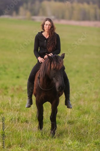 portrait of a young woman on a horse without a saddle © michal