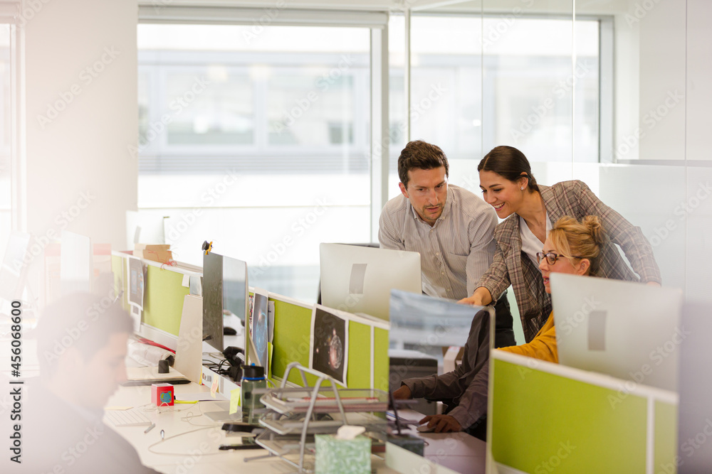 Business people brainstorming in open plan office Business people brainstorming in open plan office