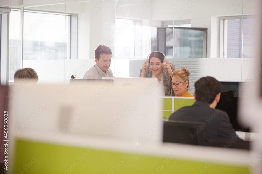 Business people brainstorming in open plan office Business people brainstorming in open plan office