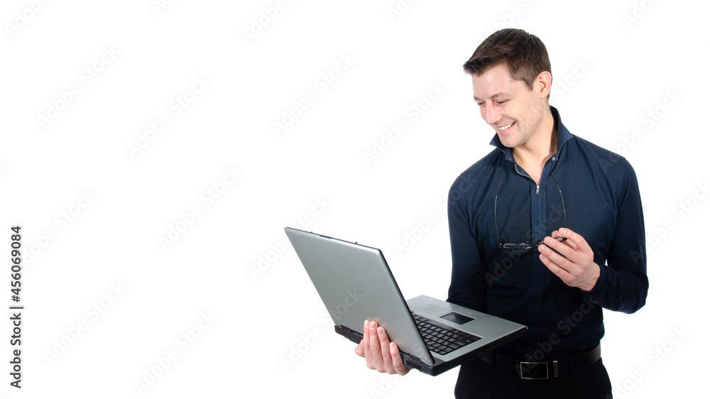 Funny handsome man with laptop. White background.