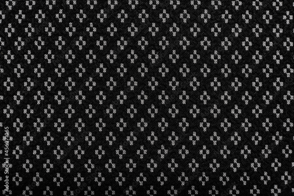 Background from fabric with a small pattern. Material for tailor, seamstress and fashion designer for sewing clothes. Texture. Pattern Background from fabric with a small pattern. Material for tailor, seamstress and fashion designer for sewing clothes. Texture. Pattern