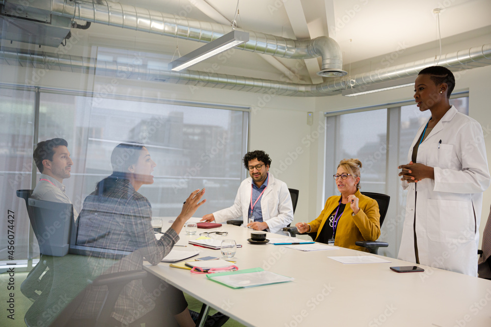 Businesswoman leading conference room meeting Businesswoman leading conference room meeting
