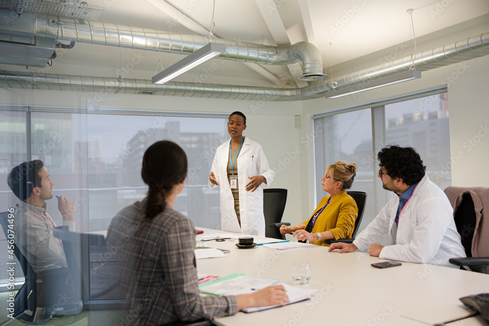Businesswoman leading conference room meeting Businesswoman leading conference room meeting