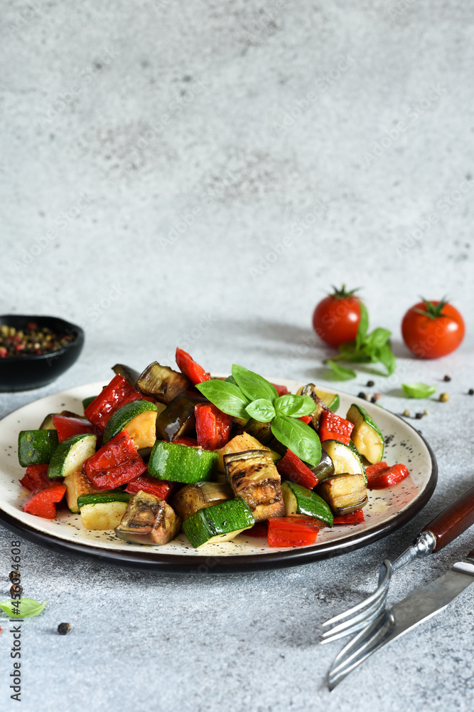 The classic dish of baked vegetables is ratataui..Baked vegetable salad with sow and basil. The classic dish of baked vegetables is ratataui..Baked vegetable salad with sow and basil.