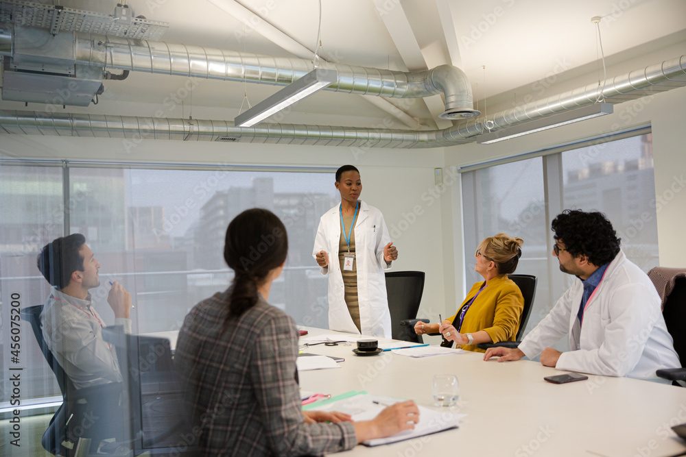 © KOTO - Businesswoman leading conference room meeting