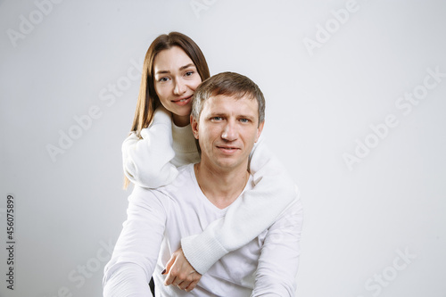 couple in love hugging on a light background