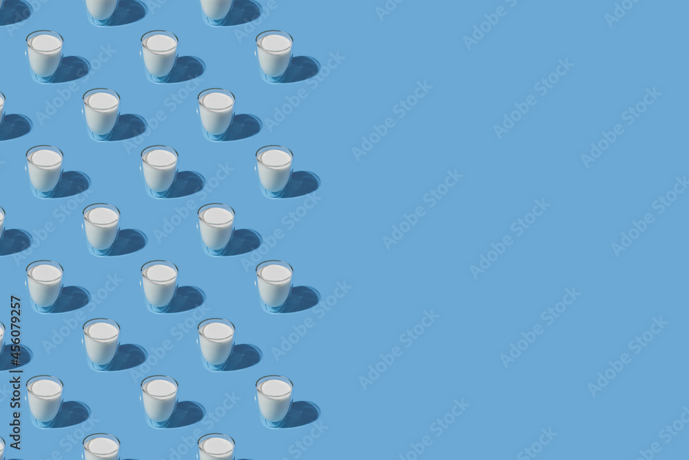 World Milk Day. Pattern on a blue background. A glass of milk. Sample. With space for text. copy space World Milk Day. Pattern on a blue background. A glass of milk. Sample. With space for text. copy space