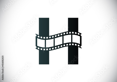 Initial H monogram alphabet incorporated with film reel. Video and movie logo concept. Font emblem. Logo for the entertainment business and company identity