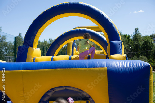 Inflatable obstacle course for fun. Trampolines for children.