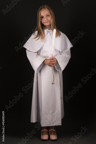 Young girl dressing for her First Communion